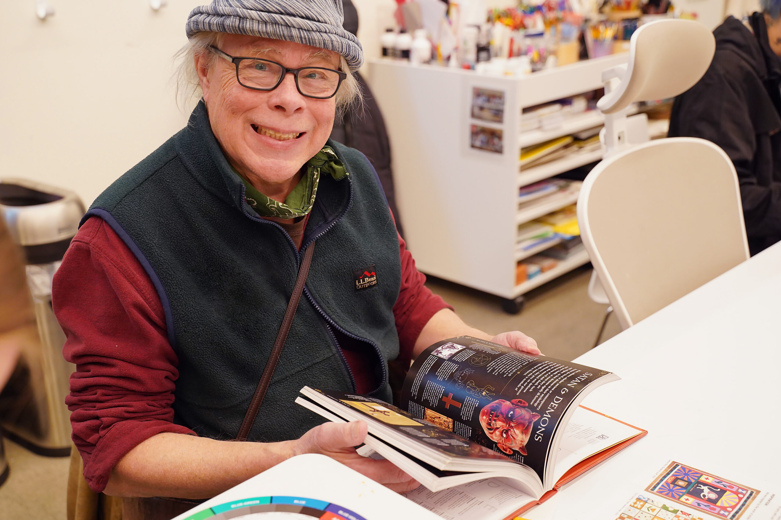 An attendee gathers ideas for a crafting activity at Art After Hours.