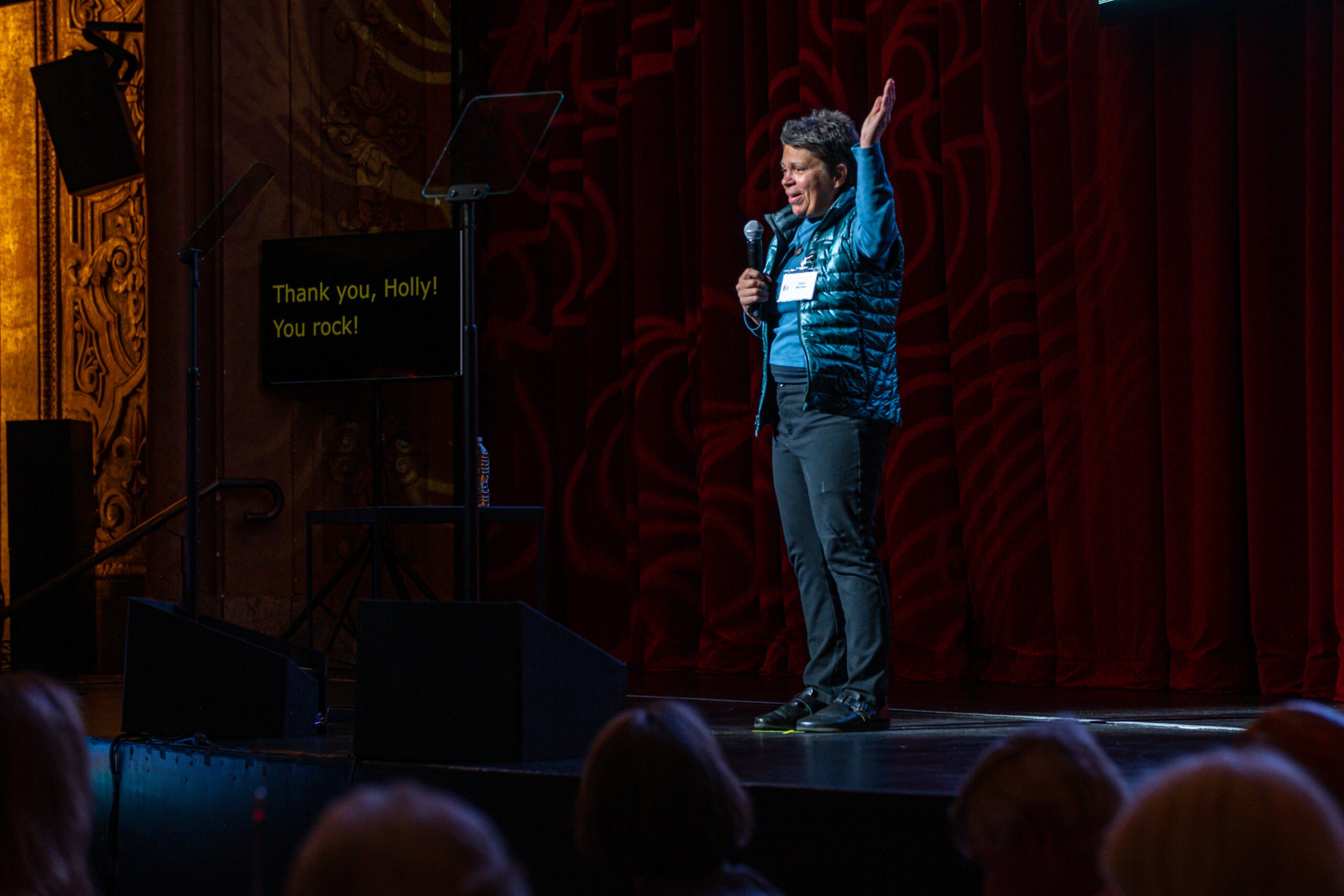 Picture of artist speaking in a microphone