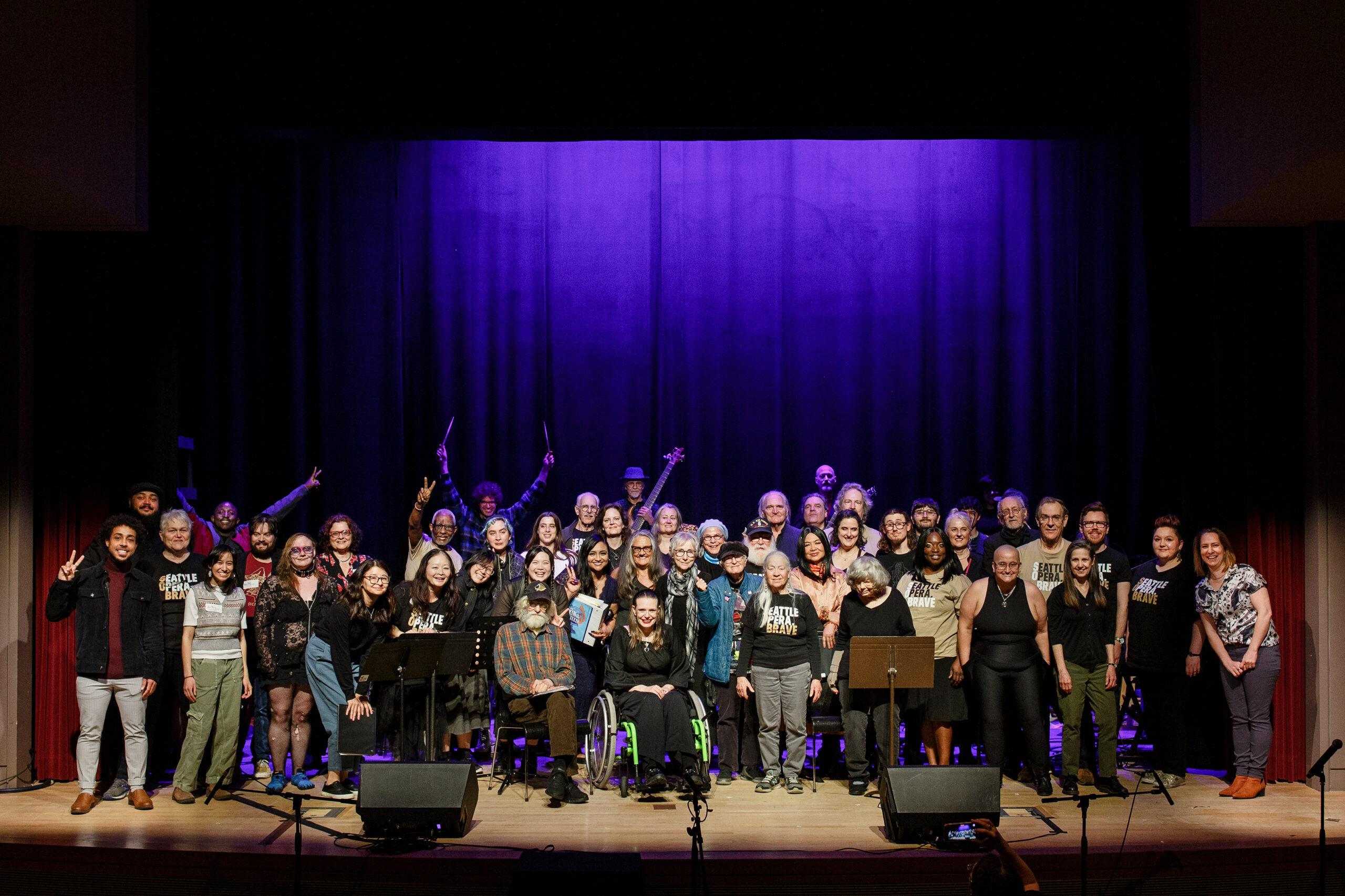The PwA Singers pose for a big group photo on stage after our annual Performance Showcase.