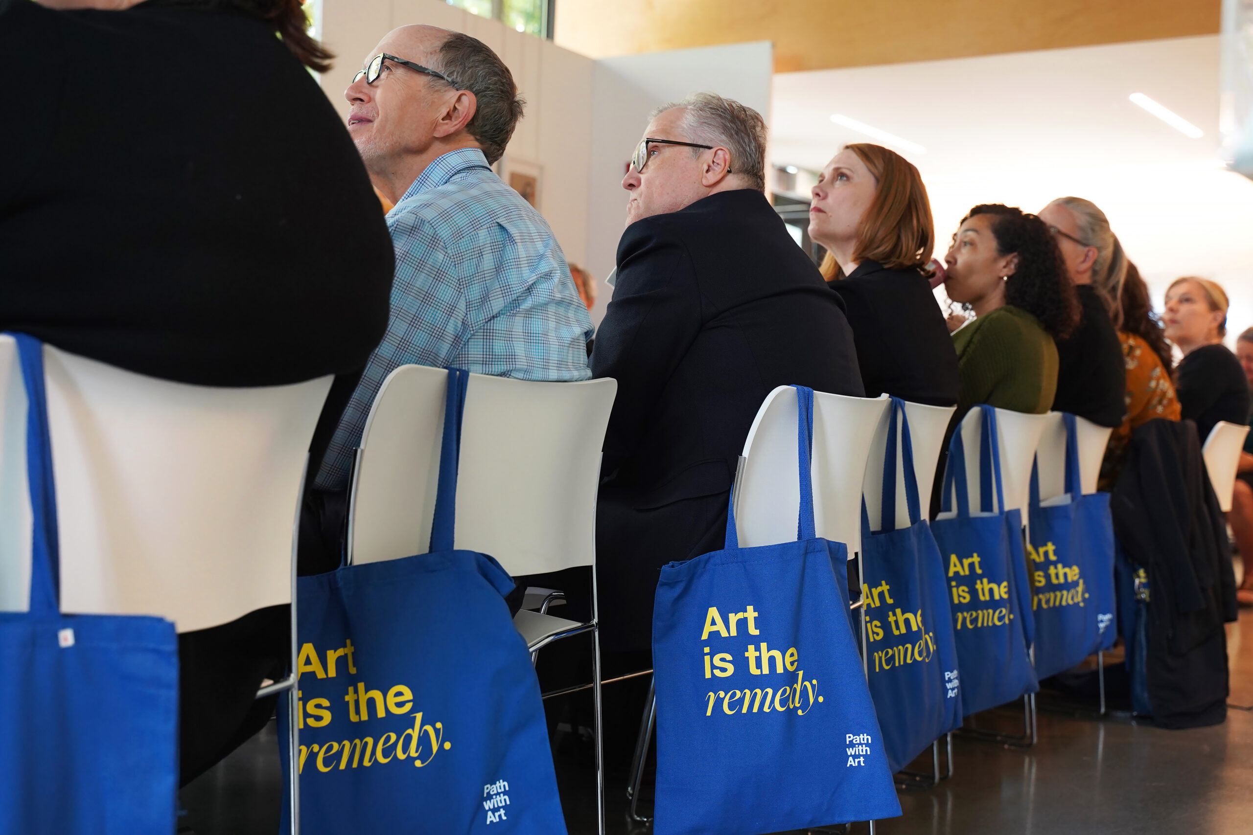 Attendees listen to a keynote speaker during a lunch-and-learn.