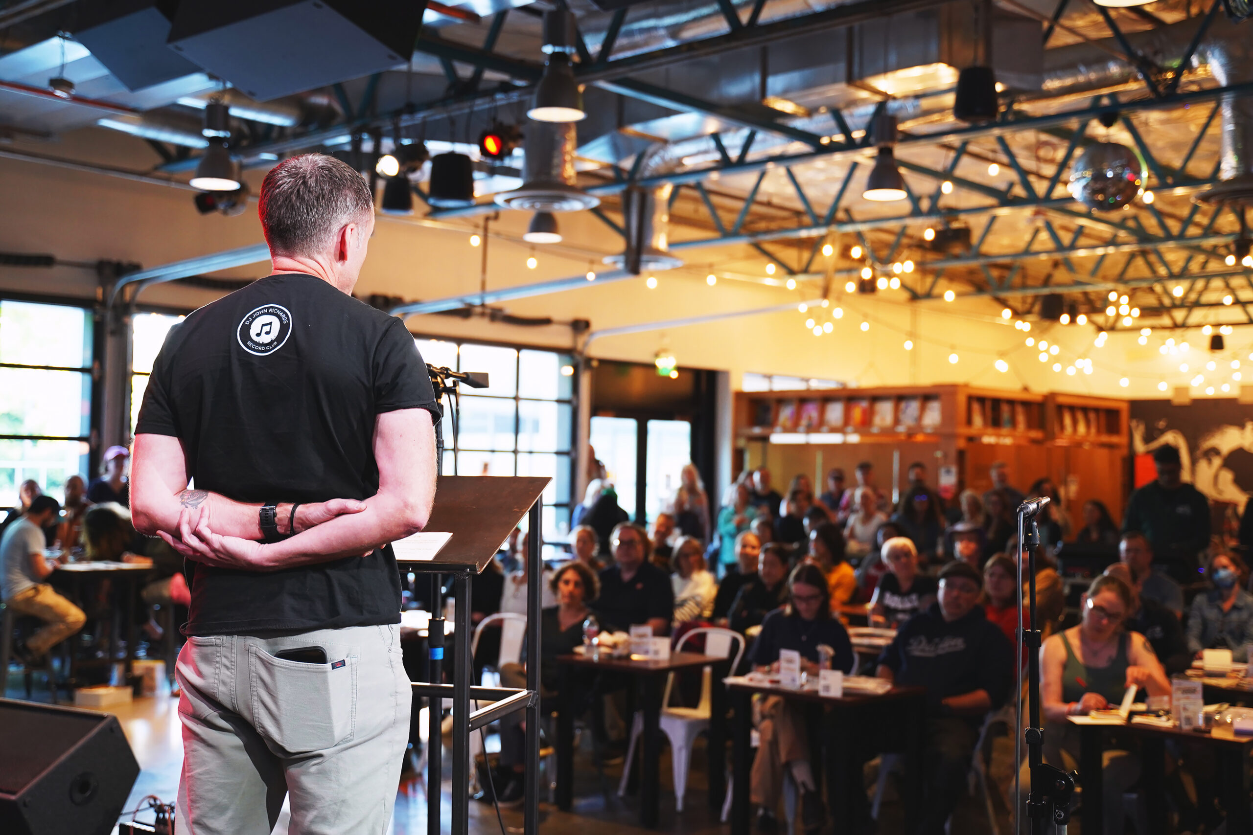 A crowd listens to a talk given at the KEXP Gathering Space during Mental Health Awareness Month.