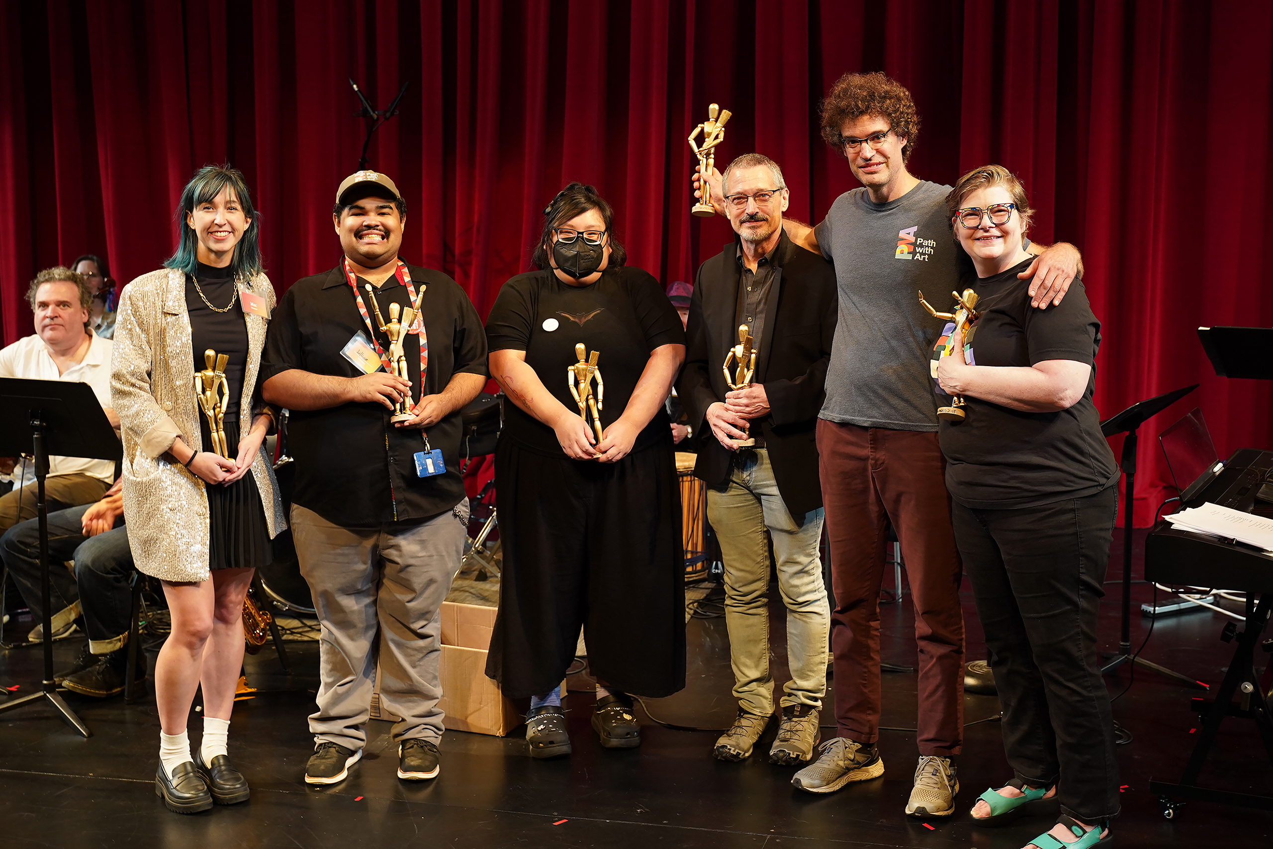 Participants and volunteers pose with awards at Path with Art's first annual Radiate! Community Festival.