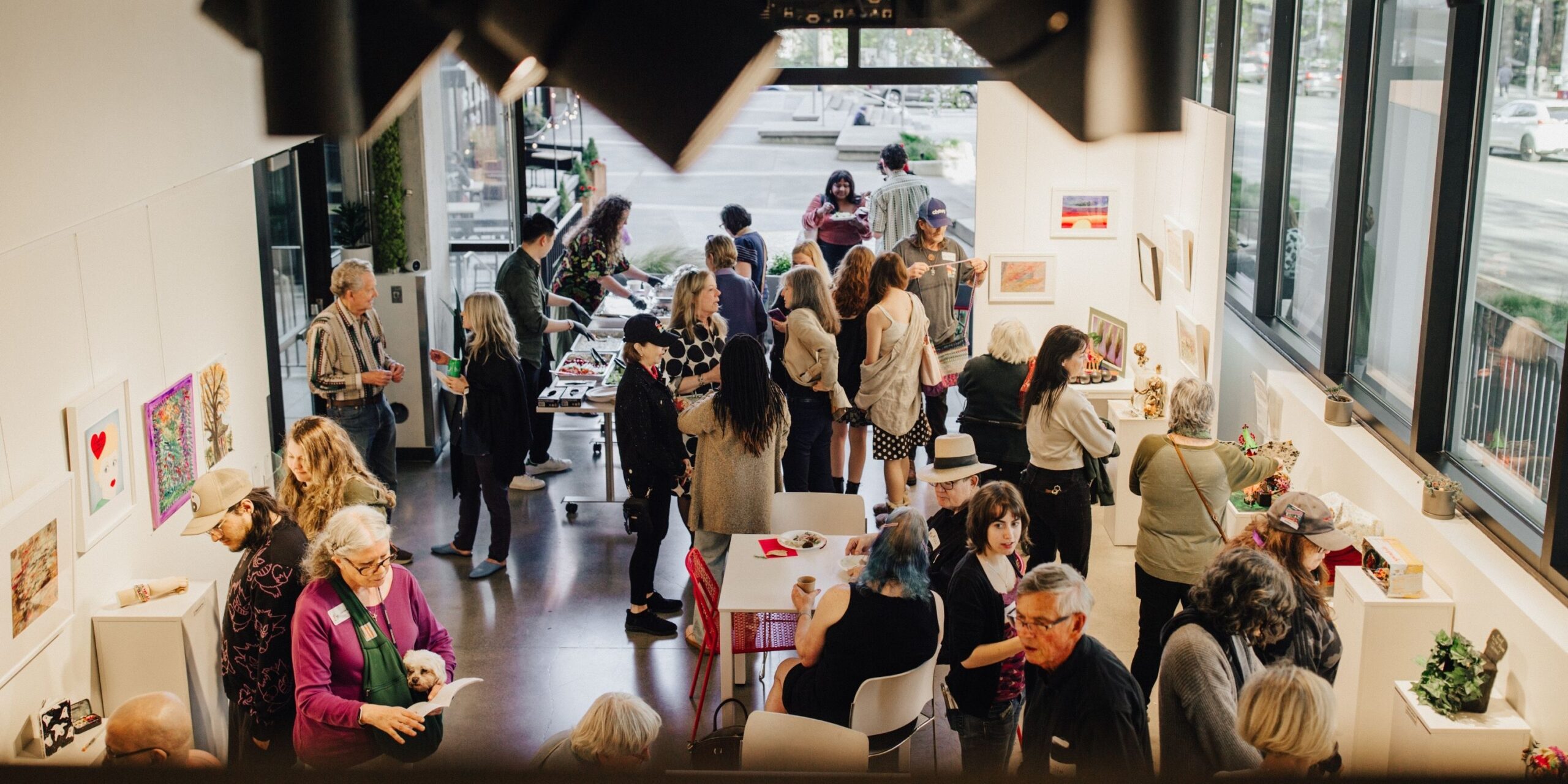 people gathered in an art gallery