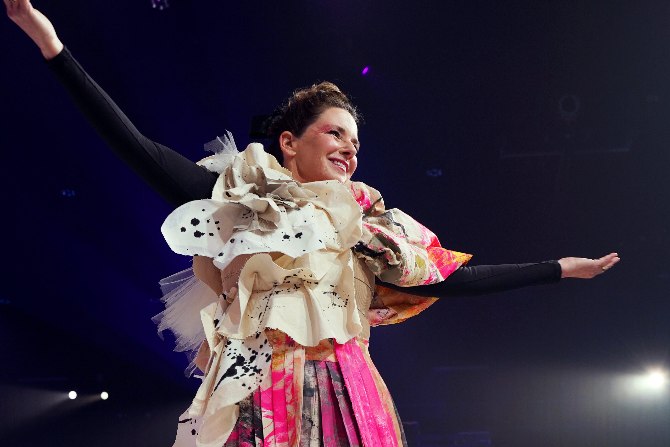 Supporter Lynn Hubbard models a work of upcycled fashion at the 2025 Art for All Ball.