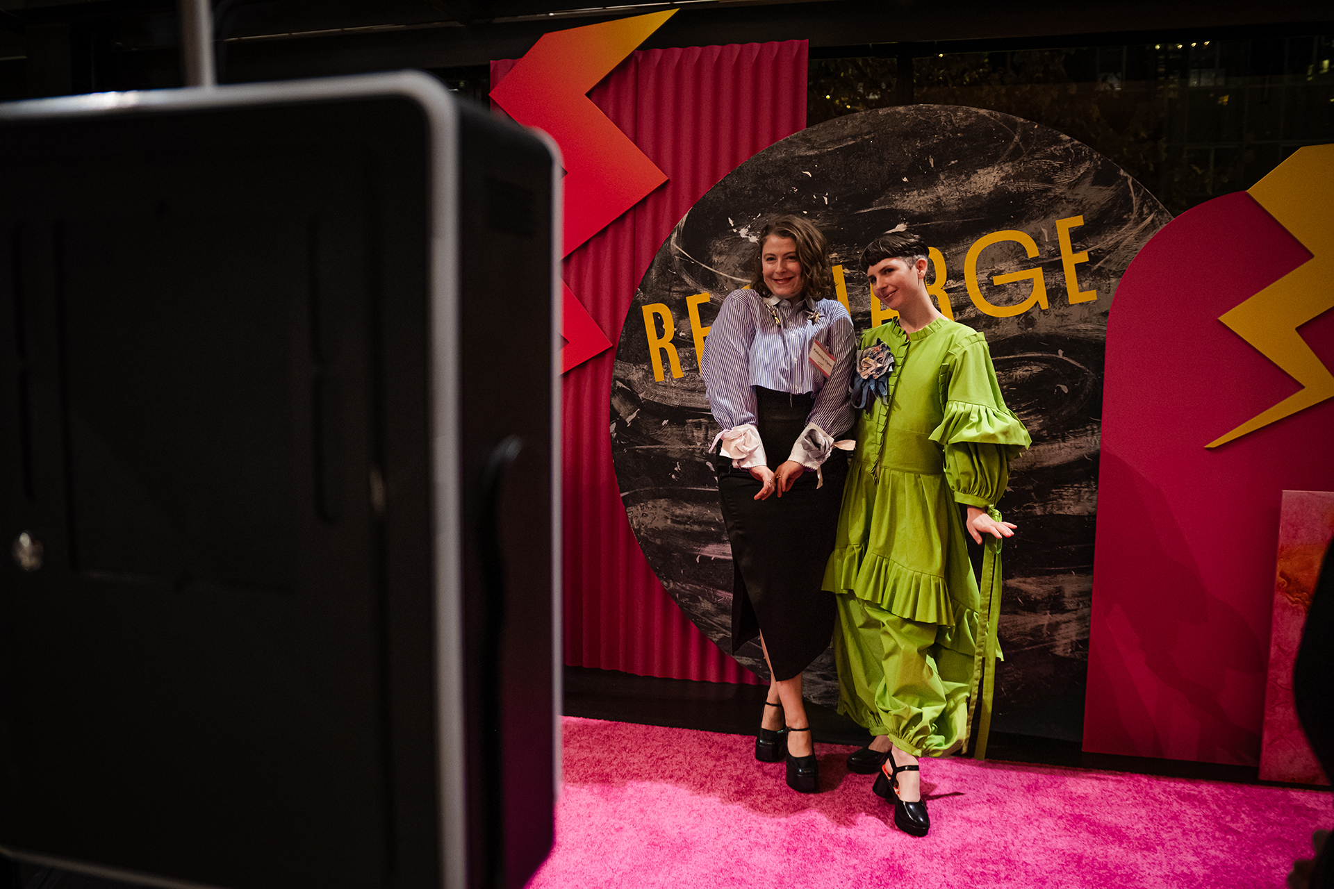 Teaching artist designers Katy Flynn and Janelle Abbott pose at the photo booth.